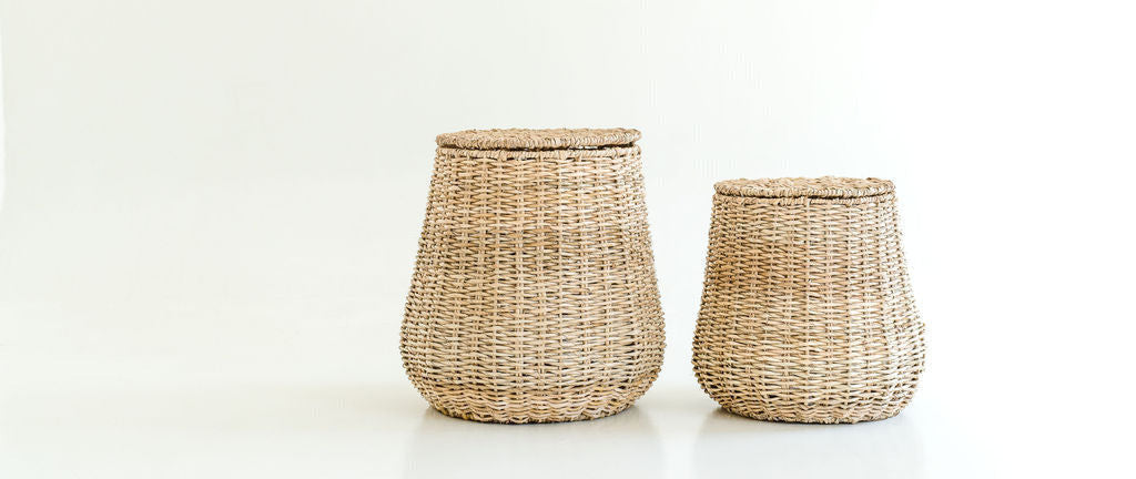 Two woven baskets on a white background